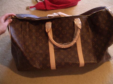 louis vuitton mens duffle bag fake|louis vuitton counterfeit.